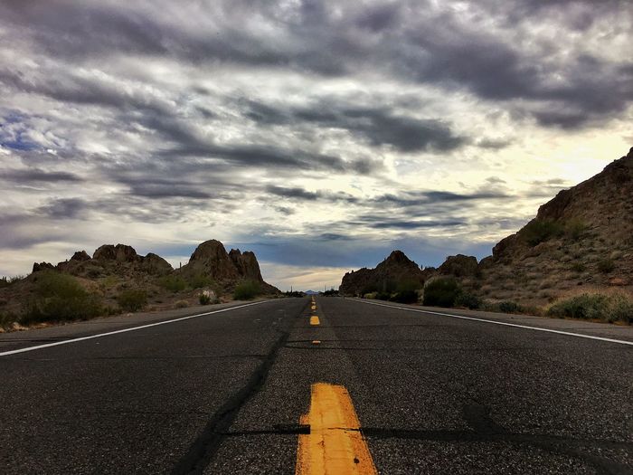 Empty road passing through landscape