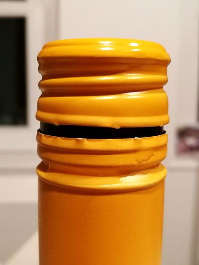 Close-up of yellow stack of beer on table
