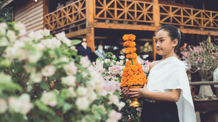 Woman holding flower bouquet