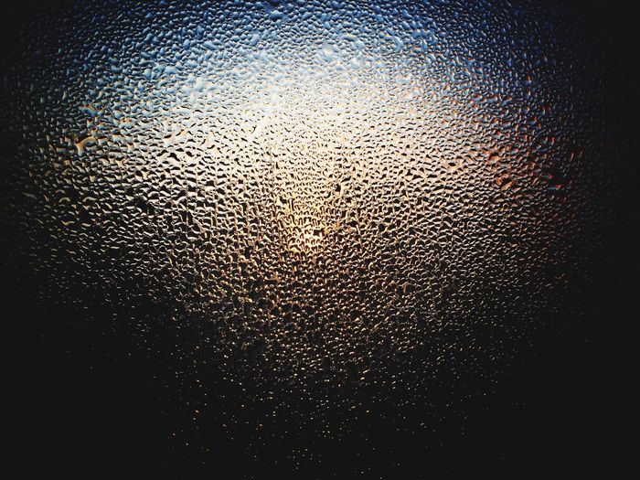 Close-up of water drops on glass