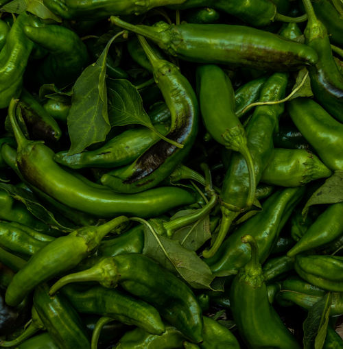 Close-up of green chili peppers for sale in market