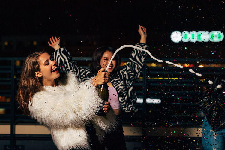 Smiling young women enjoying in night club
