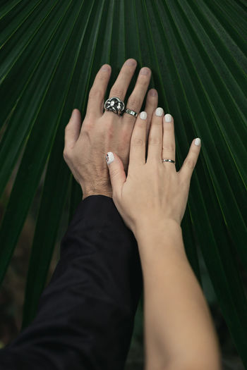 Close up wedding rings on hands concept photo