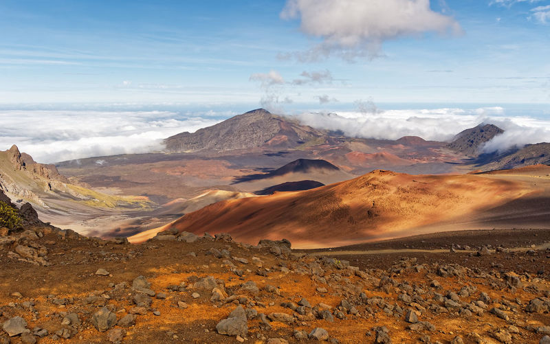 Wide volcanic landscape with lava fields in different colors, wide view, hawaii, maui, haleakala