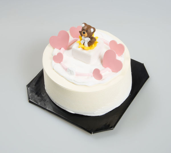 Close-up of cake on white background