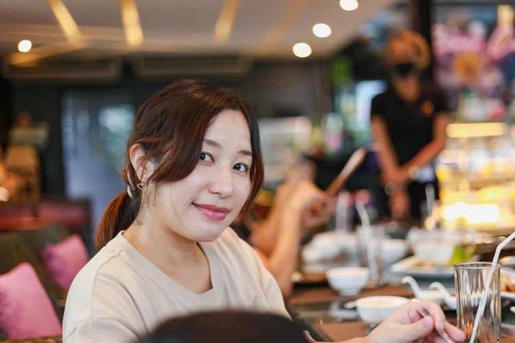 Portrait of woman in restaurant