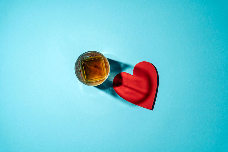 Directly above shot of heart shape against blue background
