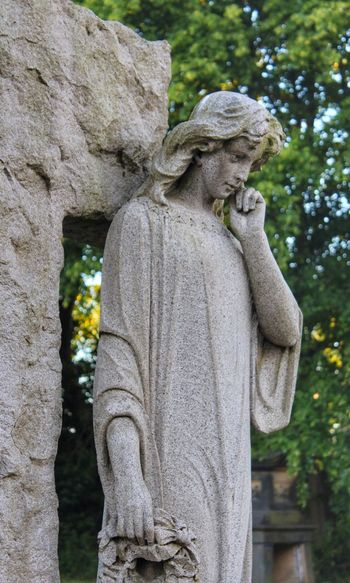 Statue of angel in cemetery