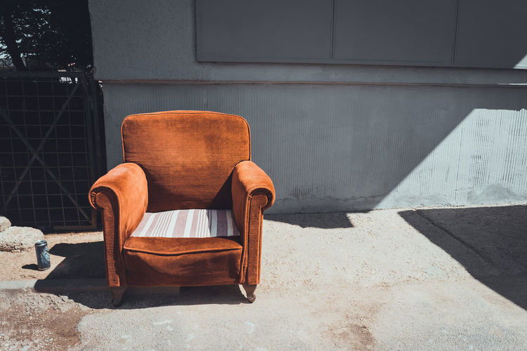 Sofa on floor against building