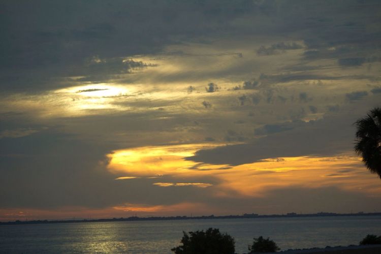 Scenic view of sea at sunset