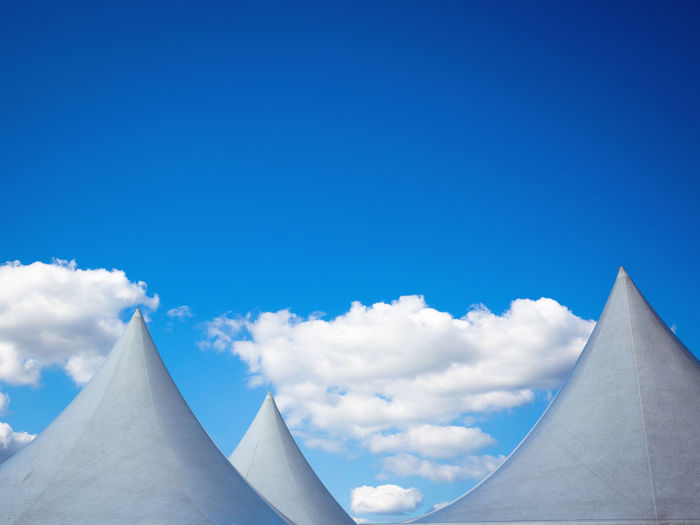 Low angle view of clouds against blue sky