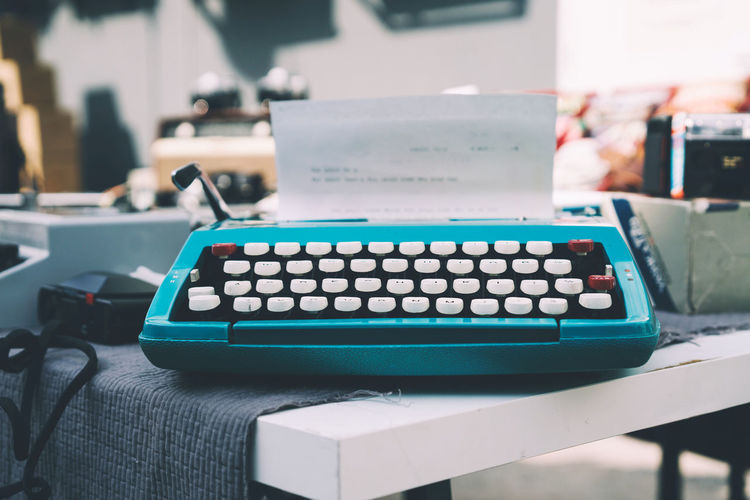 Vintage blue hand typing machine