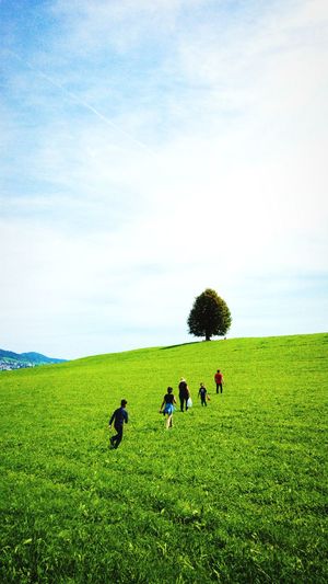 People on field against sky