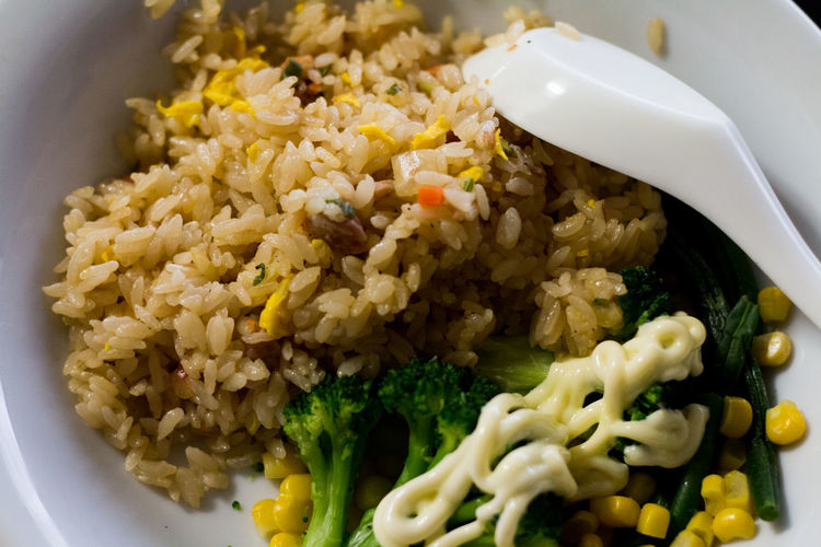 Close-up of fried rice and vegetables in bowl
