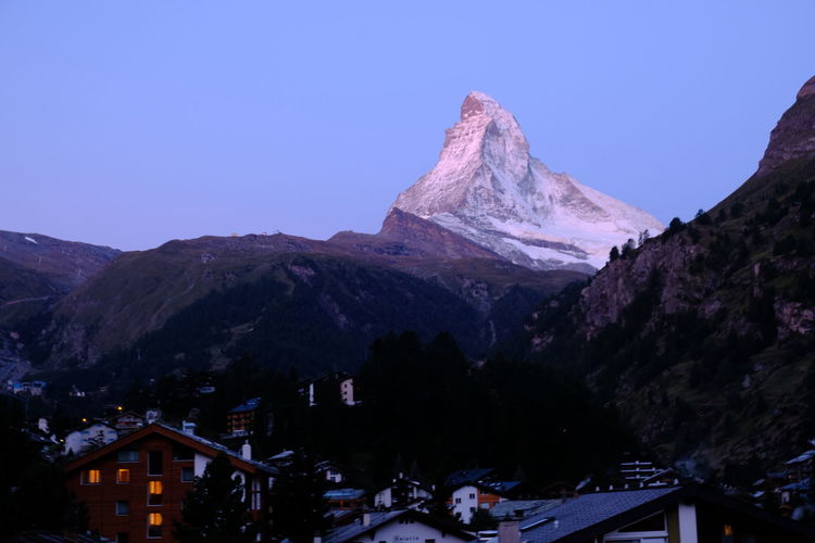 Scenic view of snowcapped mountains against clear sky