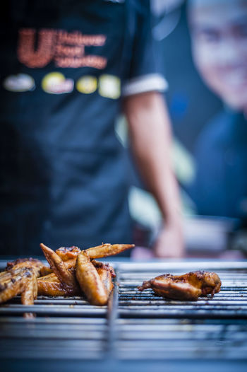 Close-up of chicken meat on barbecue grill