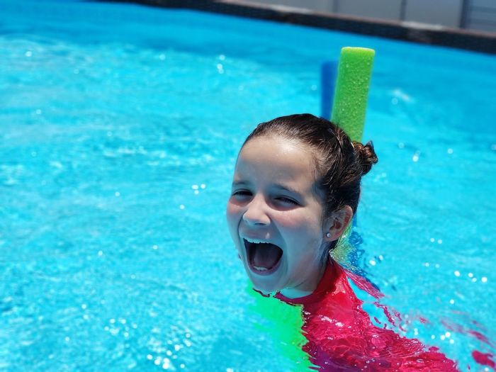 Girl shouting in swimming pool