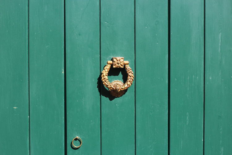 Close-up of green wooden door