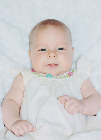 Close-up of cute baby boy sleeping on bed at home