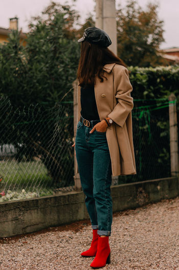 Rear view of woman standing outdoors