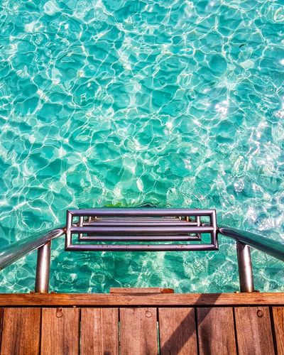 High angle view of ladder in swimming pool