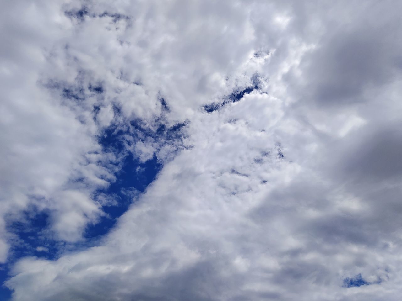 LOW ANGLE VIEW OF CLOUDY SKY OVER CLOUDS