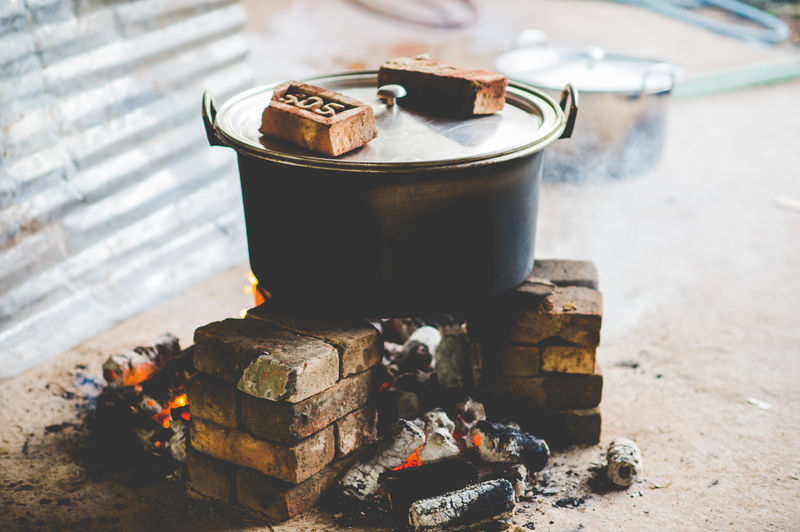 Close-up of preparing food on chulah
