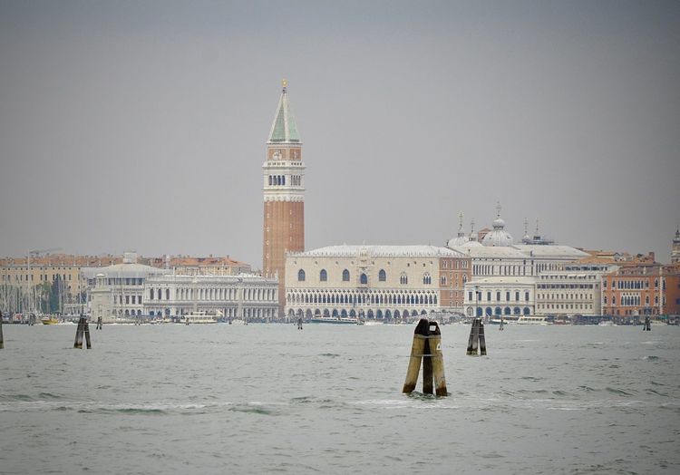 Grand canal against san marco campanile and buildings in town