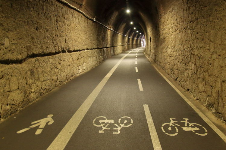 Ancient stone railway tunnel used as a trail for jogging and cycling