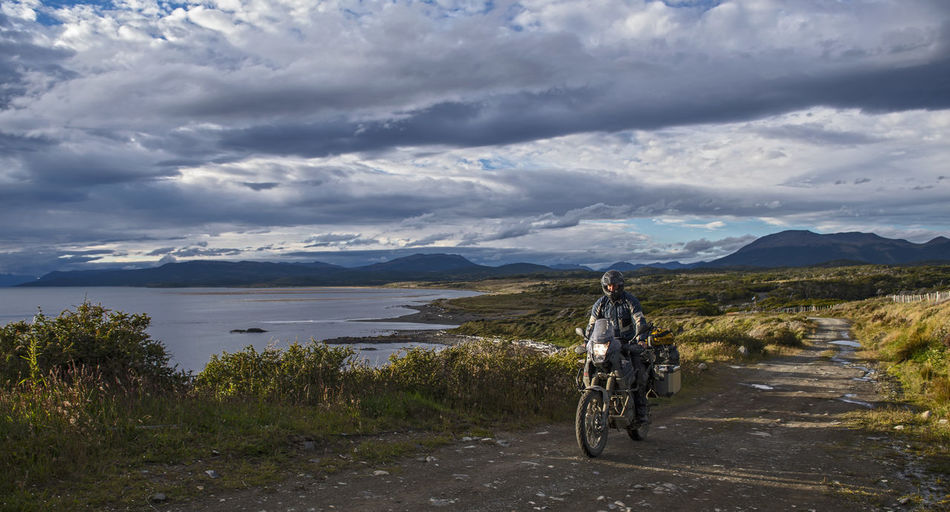 Man on off road touring motorbike riding in tierra del fuego