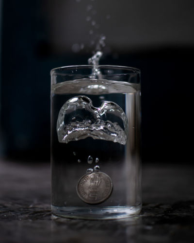Close-up of water splashing on table