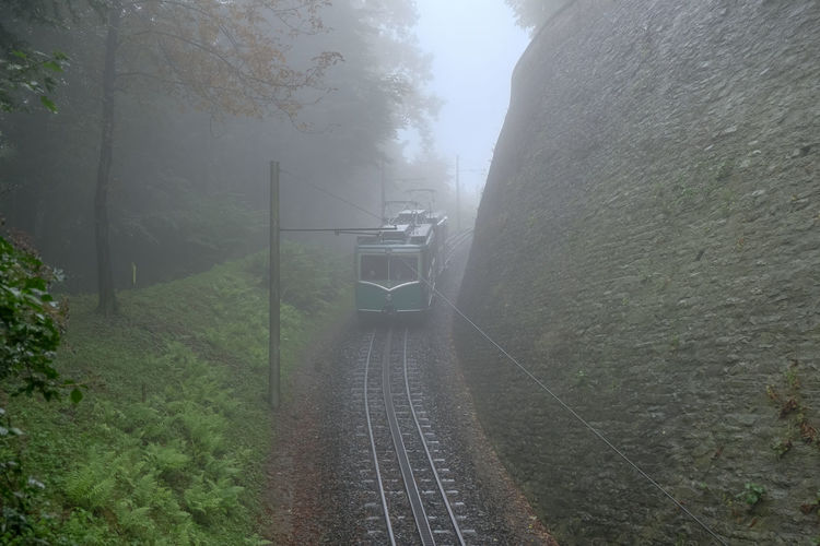 High angle view of train on railroad track during foggy weather