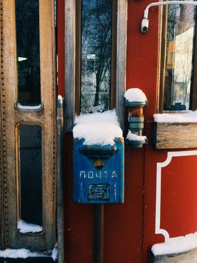 Snow on mailbox outside house