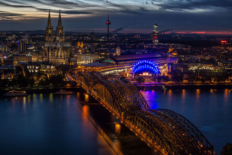 High angle view of hohenzollern bridge over rhine river against cologne cathedral