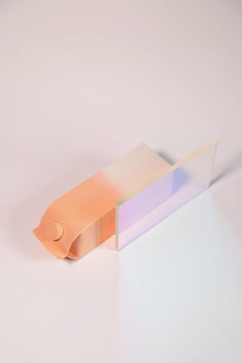 Close-up of paper toy against white background