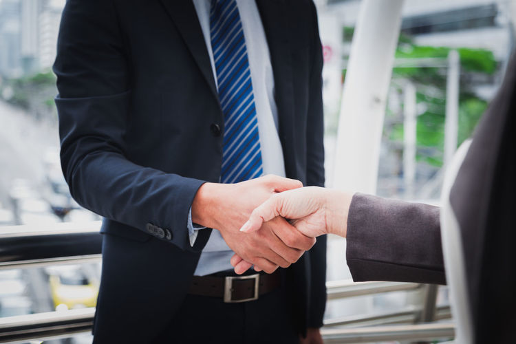 Business people shaking hands partner successful team leader and business meeting.
