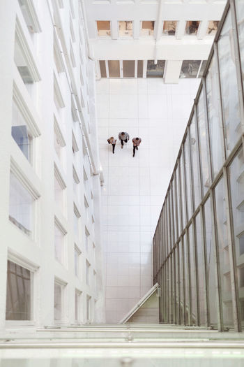 People walking on modern building