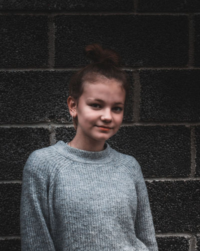 Moody portrait with girl in warm clothing.