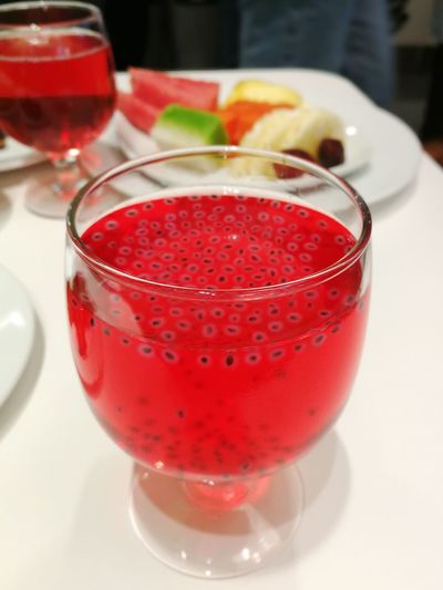 Close-up of red cocktail on table