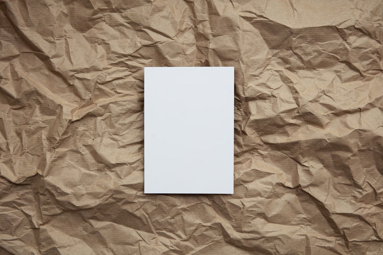 High angle view of blank paper on bed