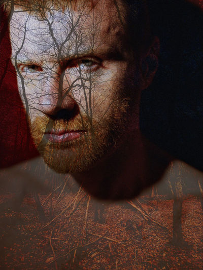 Young bearded man portrait, red hair, layered, body paint, forest, trees, psychology, looking at 