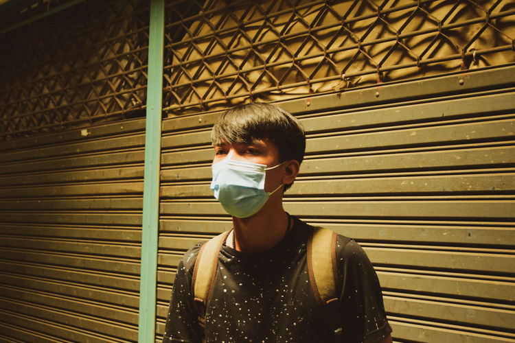 Asian men wearing masks
