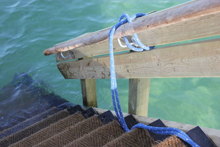 High angle view of rope tied to swimming pool