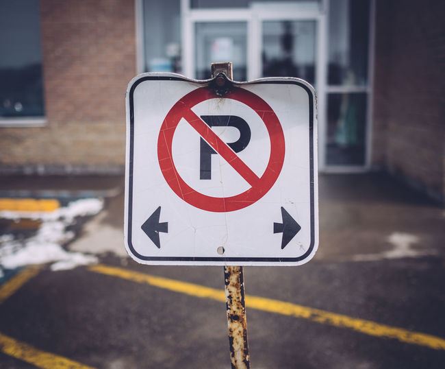No parking sign against empty road