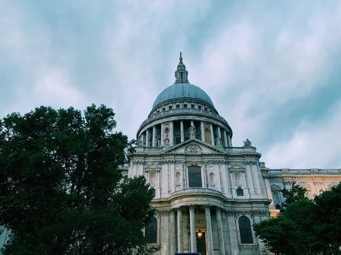 Low angle view of historic building against cloudy sky