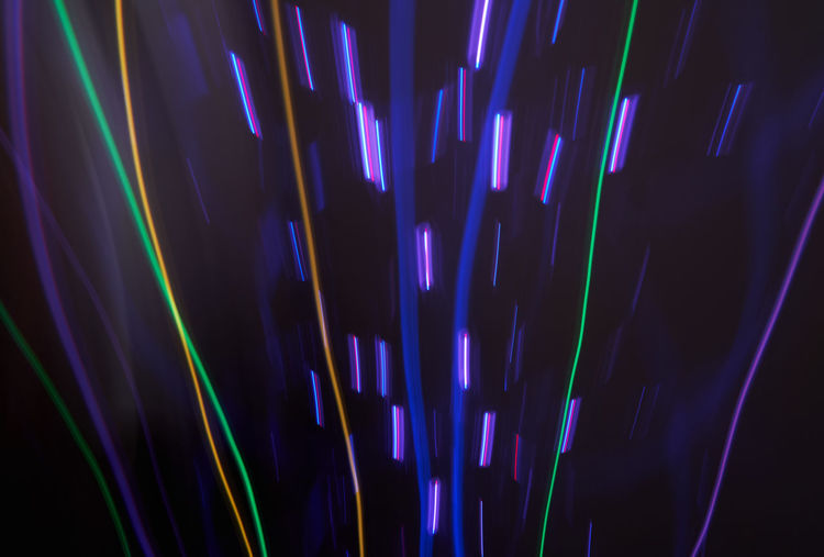 Full frame shot of illuminated lights against black background