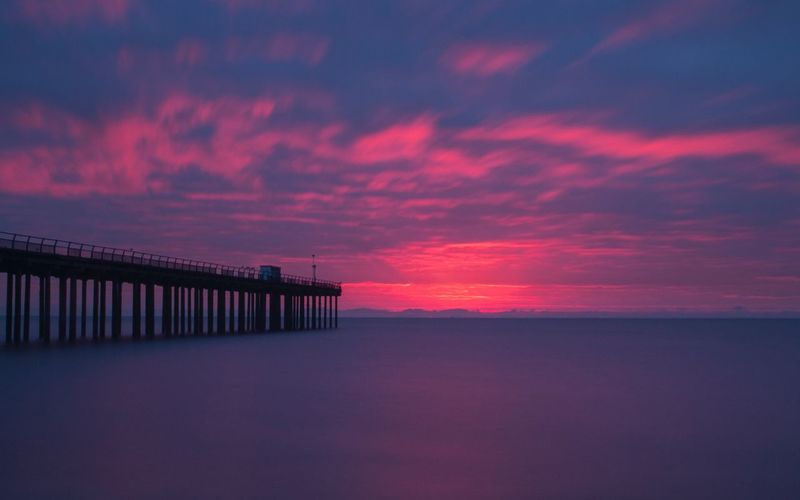 Scenic view of sea against dramatic sky