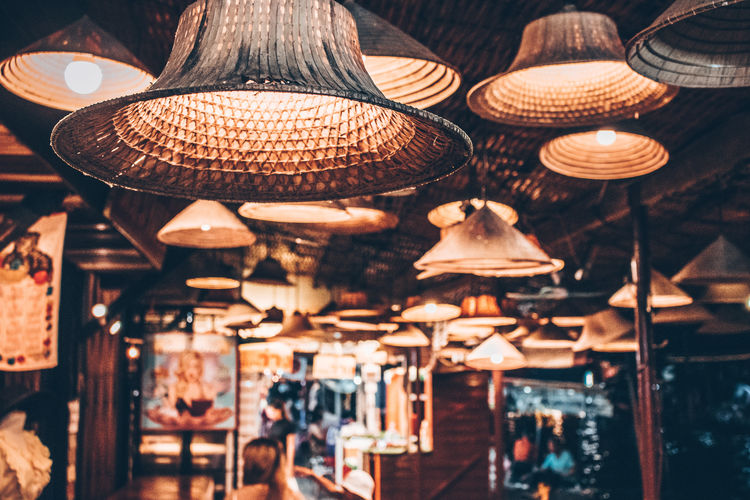 Illuminated lanterns hanging in restaurant