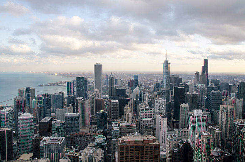 High angle view of chicago against cloudy sky