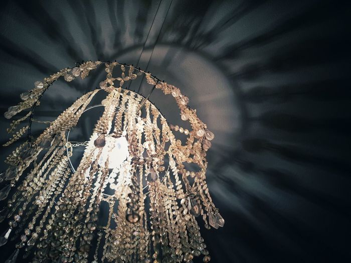 Close-up of illuminated chandelier on ceilling